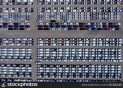 new line products car parking lot in factory industrial export for sale international by shipping cargo containers on the sea fright delivery business aerial top view from drone Thailand