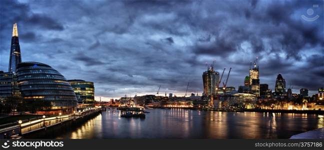 New London city hall at night , panoramic view from river.