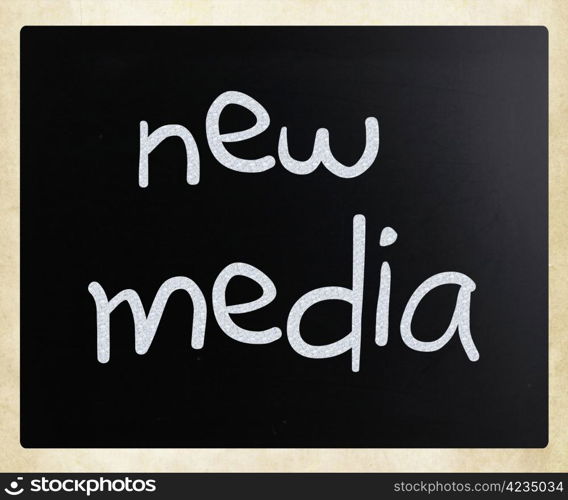 ""New media" handwritten with white chalk on a blackboard."