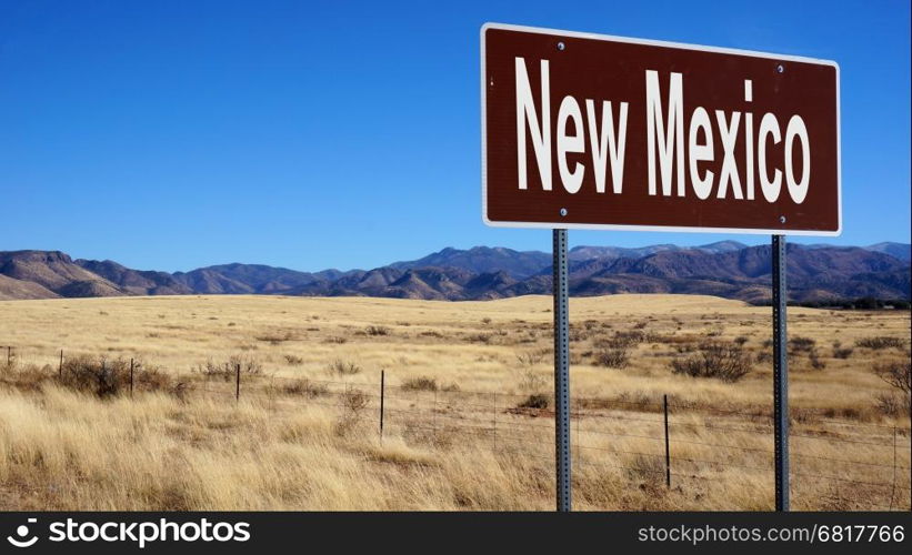 New Mexico road sign with blue sky and wilderness