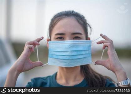 New normal Woman wearing a dust mask and Corona virus Before traveling to various places in daily life,Face mask PM2.5