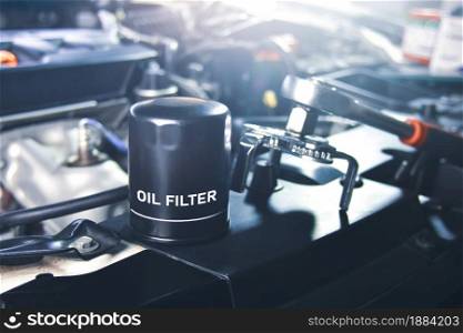 New oil filter of the car for engine oil system maintenance in the repair garage