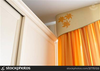 New orange curtain and modern white case
