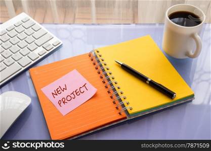 New Project word on note pad stick on blank colorful paper notebook at workspace, concept for brainstorming