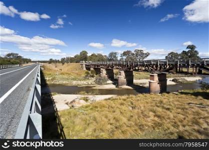 New road bridge side by side with the old railway bridge over the Tenterfield Creek, Tenterfield, New South Wales, Australia,