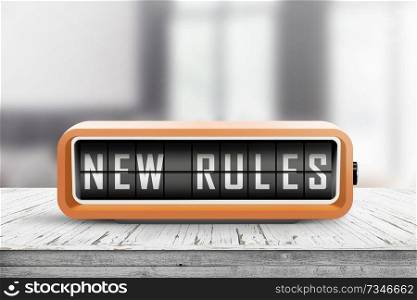 New rules alarm message on a wooden desk in a bright indoor environment