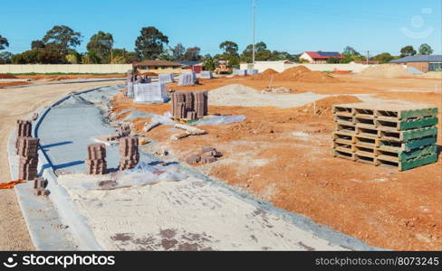 new sidewalk during construction and new plots for homes construction