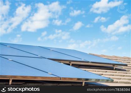 new solar panels on the roof of modern suburban house