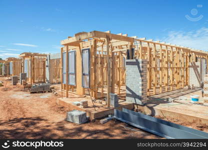 new suburban homes currently under construction in row