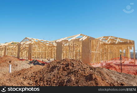 new suburban homes currently under construction in row