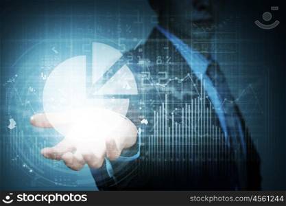 New technologies for business. Close up of businessman hand presenting digital market graphs