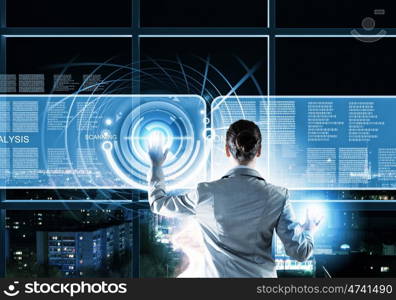 New technologies. Image of businesswoman pushing icon on media screen