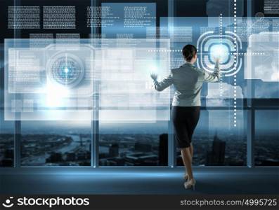 New technologies. Image of businesswoman pushing icon on media screen