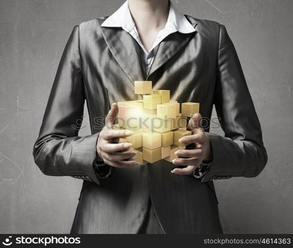 New technologies integration. Close view of businesswoman holding cube figure in hands