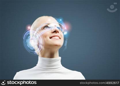 New technologies. Young woman in white against media background wearing headphones