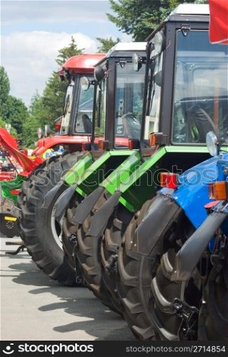 new tractors standing in a row, ready to work