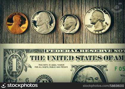 New uncirculated US money over wooden background