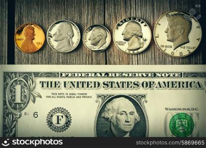 New uncirculated US money over wooden background