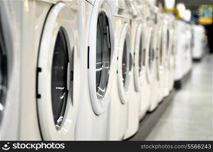 new wash machines in row at supermarket