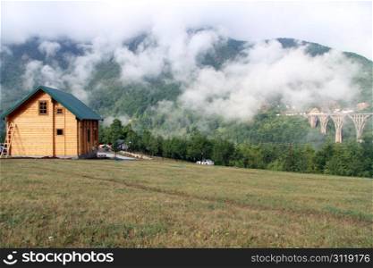 New wooden house near bridge in canyon Tara, Montenegro