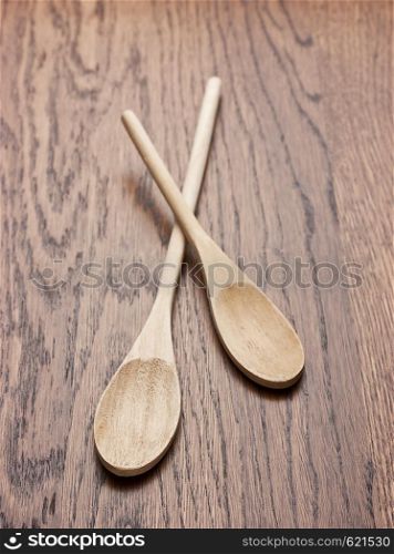 New wooden spoon on wooden table