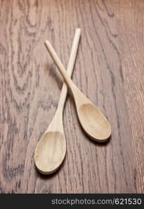 New wooden spoon on wooden table