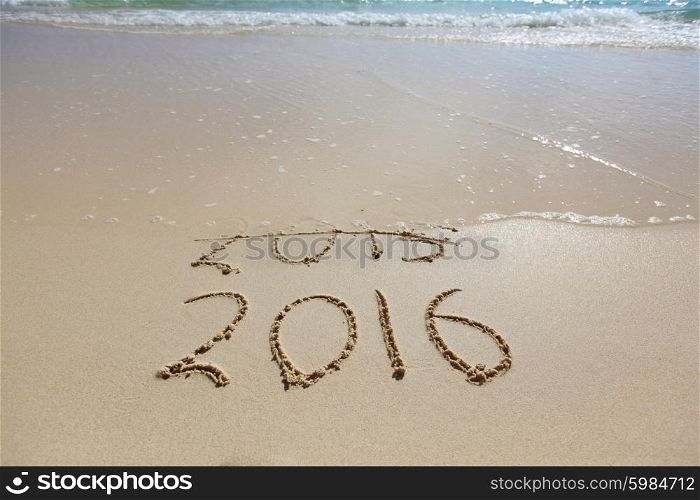 New Year 2016 is coming concept. New Year 2016 is coming concept. Happy New Year 2016 replace 2015 concept on the sea beach