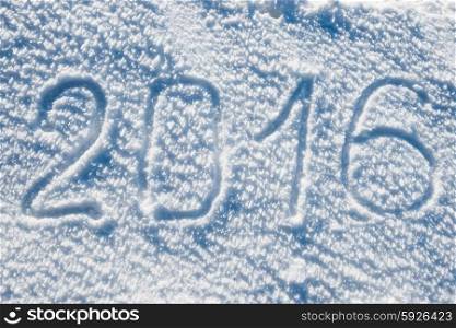 New year 2016 written on the white snow