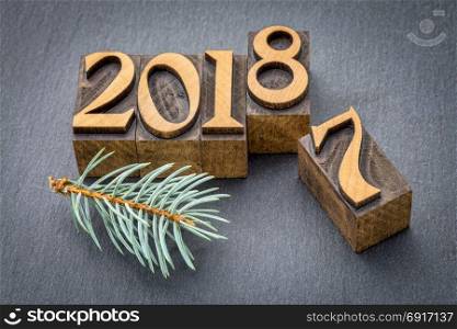 new year 2018 replacing the old year 2017 - letterpress wood type printing blocks on a slate stone