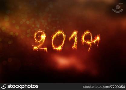 New Year 2019 text handmade written sparklers fireworks. Beautiful Shiny Golden numbers 2019 isolated on black background for design