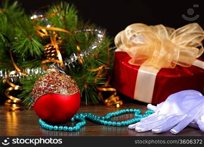 New Year&acute;s still life. Decorations and ribbons on a bright color background