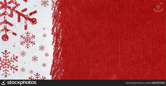 new year background on snow. christmas card or new year background made of snowflakes symbols handwritten on snow and red craft paper