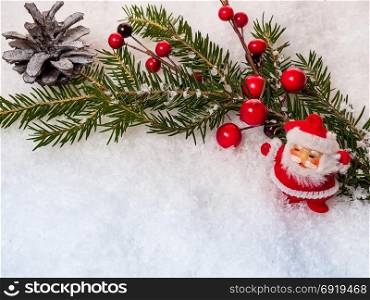 New Year background with Santa Claus, Christmas tree branch and cones on snow
