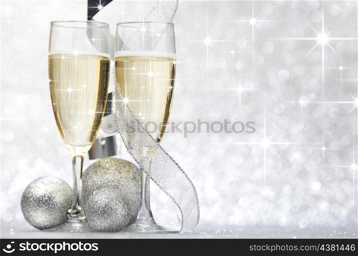 New year card with Champagne and decoration over shiny stars background