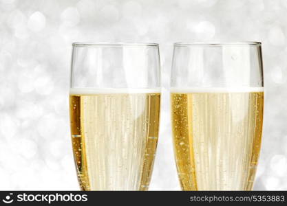 New year card with Champagne on shiny glitter background