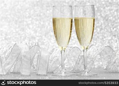 New year card with Champagne on shiny glitter background
