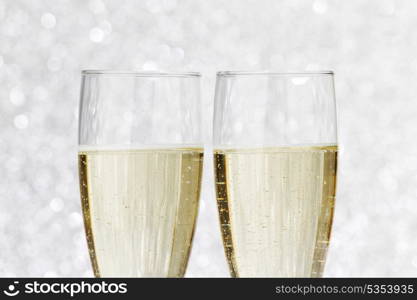 New year card with Champagne on shiny glitter background