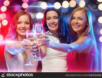 new year, celebration, friends, bachelorette party, birthday concept - three beautiful woman in evening dresses with champagne glasses