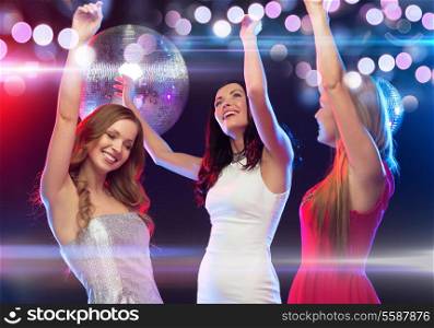 new year, celebration, friends, bachelorette party, birthday concept - three beautiful woman in evening dresses dancing in the club