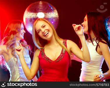 new year celebration, friends, bachelorette party, birthday concept - three beautiful woman in evening dresses dancing in the club