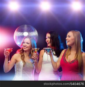 new year, celebration, friends, bachelorette party, birthday concept - three women in evening dresses with cocktails and disco ball