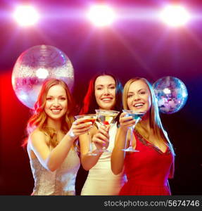 new year, celebration, friends, bachelorette party, birthday concept - three women in evening dresses with cocktails and disco ball