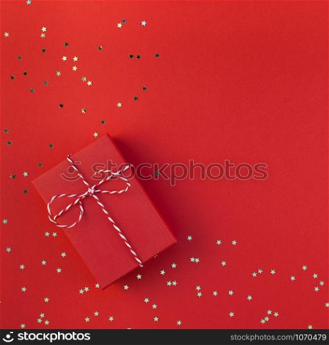 New Year Christmas presents ribbon flat lay top view Xmas 2019 holiday celebration handmade gift box red paper golden sparkles background copyspace. Square Template mockup greeting card text design