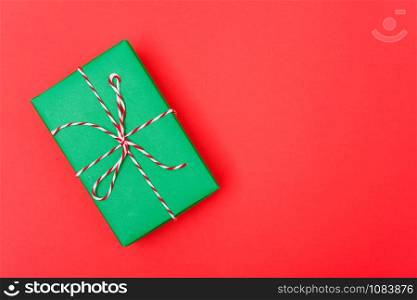 New Year, Christmas Xmas holiday composition, Top view green gift box on red background with copy space