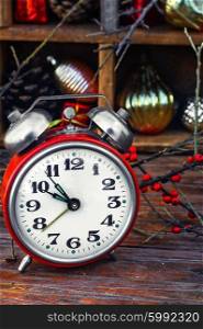 New year composition with alarm clock. Clock alarm clock with bells on the background of Christmas decorations