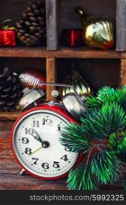 New year composition with alarm clock. Clock alarm clock with bells on the background of Christmas decorations
