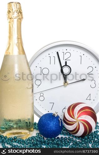 new year decoration.champagne, baubles and clock face.