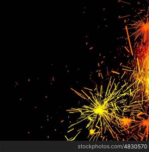 New Year eve holiday background with fireworks border, colorful sparks isolated on black background with text copy space