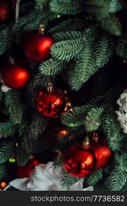 new year festive decorations in warm colors, christmas tree and christmas wreath