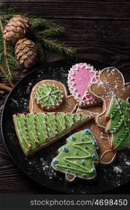 New year homemade gingerbread. New year homemade gingerbreads on wooden background. Christmas theme.
